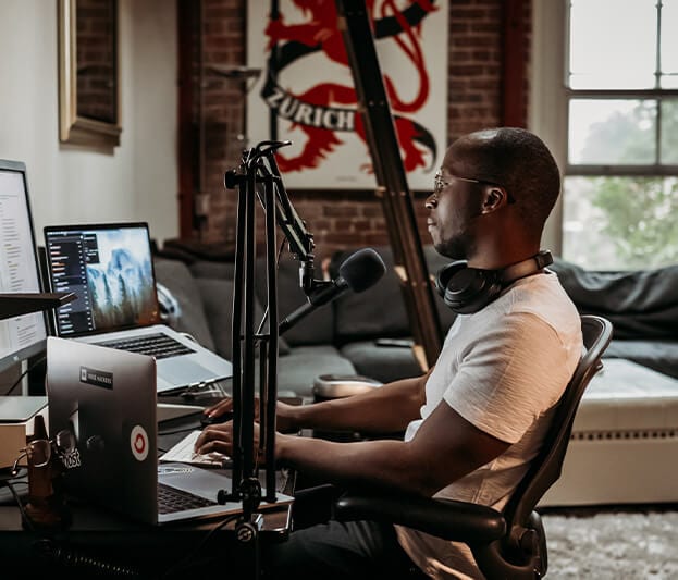 Podcaster in his home setting up for his next episode