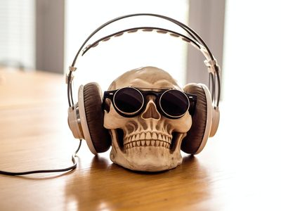 Skull wearing headphones and sunglasses