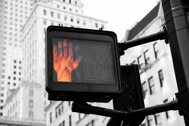 Hand on do not cross sign
