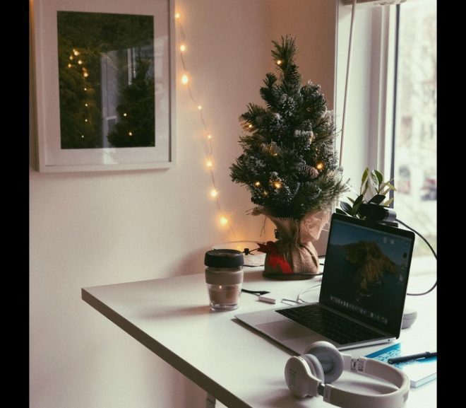 Mini christmas tree, standing desk, laptop and headphones